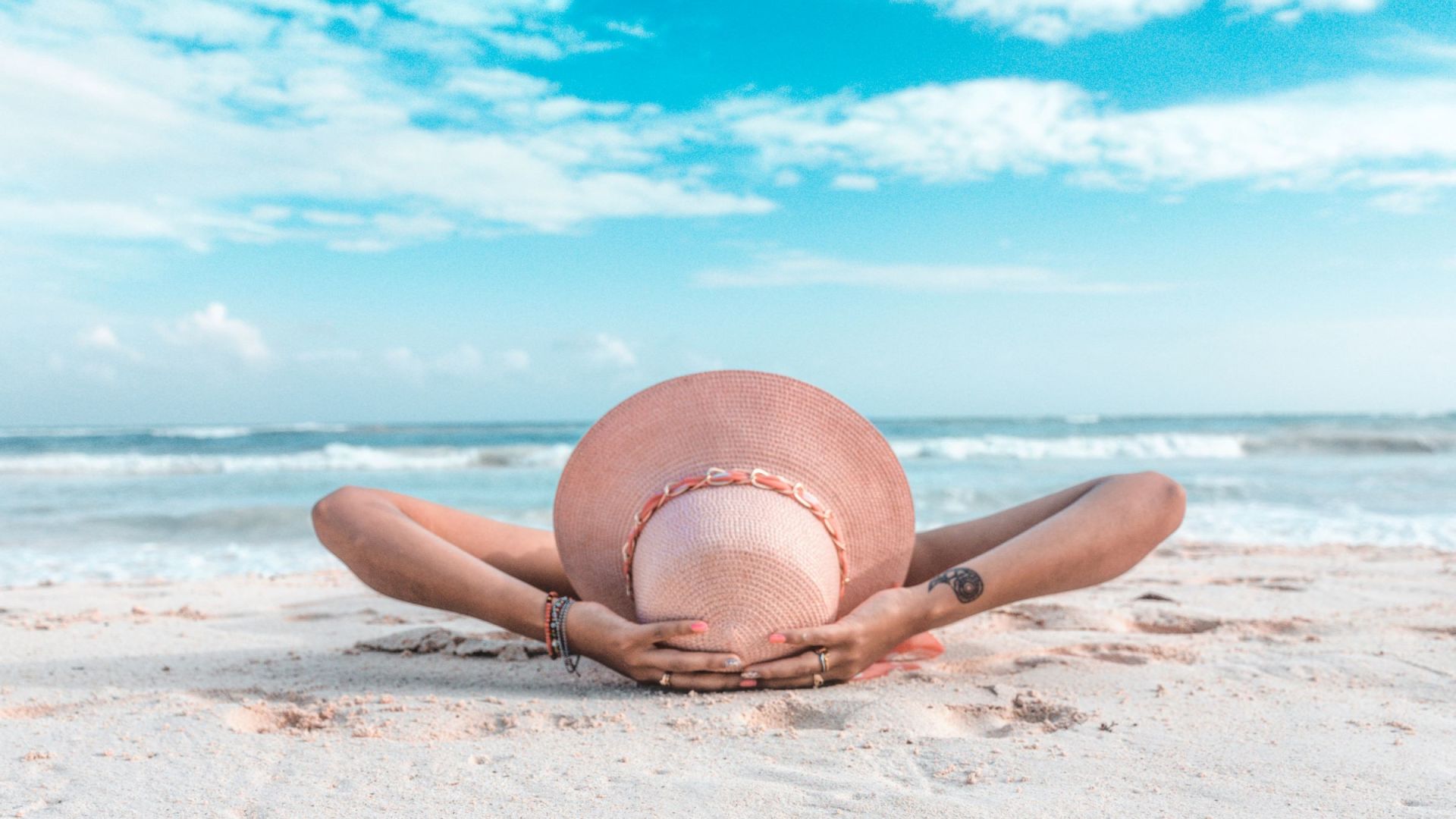 A Person Lying On The Beach
