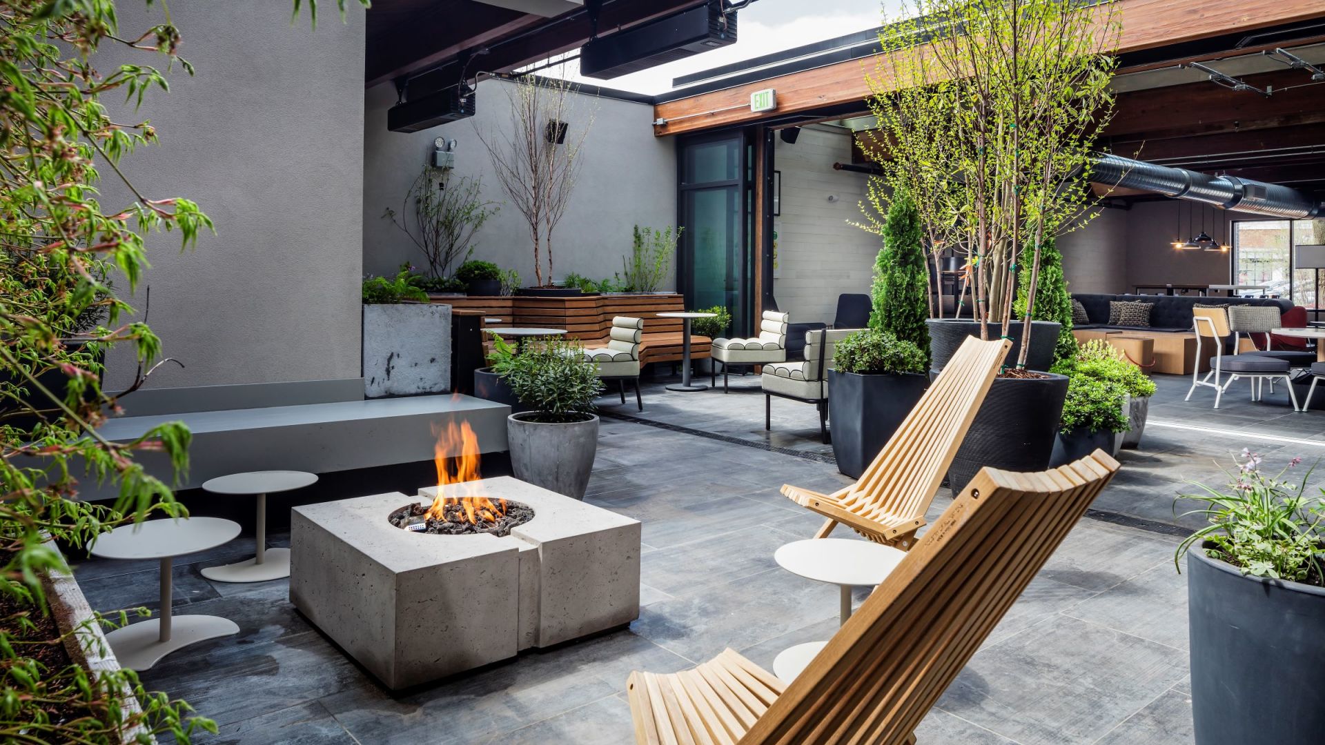 A Fire Pit With Chairs And Tables